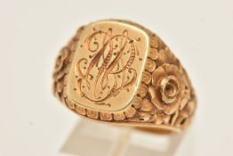 A HEAVY YELLOW METAL SIGNET RING, rounded rectangular form with engraved monogram, to the textured