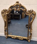 A REPRODUCTION GILT RESIN OVERMANTEL MIRROR, with scrolled, foliate and floral details Dimensions:
