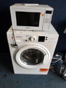A HOTPOINT NSWF 743U W UK WASHING MACHINE 60x50x85cm high, along with a Panasonic microwave (both