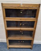 AN EARLY 20TH CENTURY OAK ELEASTIC BOOKCASE, four glass hide and fall doors Dimensions:width 87cm