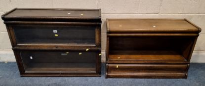 GLOBE WERNICKE, AN OAK SECTIONAL BOOKCASE, with two hide and fall glass doors, along with a