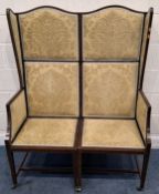 AN EDWARDIAN MAHOGANY HIGH-BACKED TWO-SEATER WING-BACK SOFA, with gold and foliate upholstery,