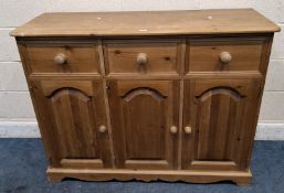 A MODERN PINE SIDEBOARD, fitted with three drawers over three cupboard doors Dimensions:width