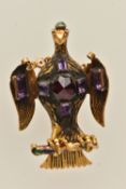A YELLOW METAL, ENAMELLED AND GEM SET EAGLE PENDANT, research suggests it is modelled after King