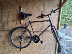 A RALEIGH NEXOS MOUNTAIN BIKE with a 21-inch frame and 10-speed Shimano gears