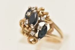 A YELLOW METAL DIAMOND AND SAPPHIRE RING, set with three marquise cut blue sapphires, and six
