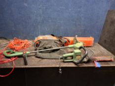 A FLYMO GARDEN VAC with collection bag (illfitted), a Bosch Easy Grass cut 26 strimmer (both PAT