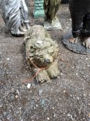 A PAINTED CONCRETE GARDEN FIGURE OF A PRONE LION 50cm long Dimensions:50cm long Condition Report: