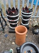 THREE CHIMNEY POTS, including two that are painted with castellated tops, 77 cm high Dimensions:77cm