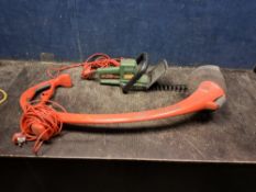 A FLYMO REVOLUTION 2500 STRIMMER (PAT pass and working), a Black and Decker hedge trimmer (PAT