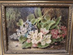 OLIVER CLARE (1853-1927) STILL LIFE STUDY OF PRIMROSES AGAINST A MOSSY BANK, signed bottom right,