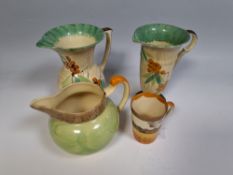 A GROUP OF FOUR ART DECO JUGS BY MYOTT, comprising two jugs of differing forms with the same hand