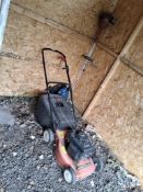 A MOUNTFIELD PETROL LAWN MOWER along with a Mountfield petrol strimmer (both engine pull freely