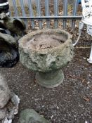 A CONCRETE GARDEN URN, constructed in two parts with acanthus leaf detail, 46 cm high Dimensions: