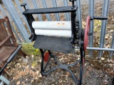 TWO EARLY 20th CENTURY PAINTED CAST IRON MANGLES, both 86cm wide Dimensions:86cm wide Qty: 2