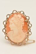A 9CT GOLD CARVED SHELL CAMEO BROOCH, of an oval form, depicting a lady in profile, claw set