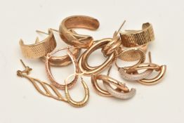 AN ASSORTMENT OF YELLOW METAL EARRINGS, to include hoops and drop earrings, some single earrings,