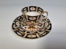 A ROYAL CROWN DERBY PORCELAIN TEA TRIO IN THE 'DOUBLE DIAMOND' IMARI PATTERN (2451), comprising a