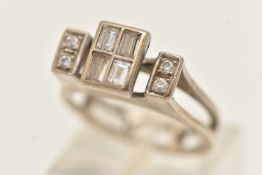 A WHITE METAL DIAMOND RING, of a rectangular form, set with four baguette cut diamonds, in a