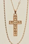A 9CT GOLD CROSS PENDANT NECKLACE, the open work floral pattern cross fitted with a tapered bail,