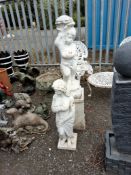 A CONCRETE GARDEN FIGURE OF A BOY ON A SQUARE BASE 127cm high and a plastic figure of a lady