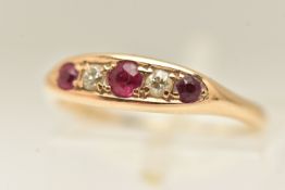 A YELLOW METAL GEM SET RING, set with three circular cut rubies and two small old cut diamonds,