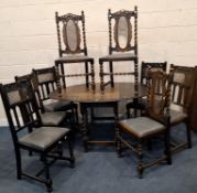 AN EARLY 20TH CENTURY OAK GATE LEG TABLE, raised on barley twist legs, united by stretchers, along