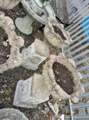 A PAIR OF CONCRETE GARDEN URNS ON STANDS with acanthus leaf detail to bowls, square bases with