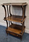 A REGENCY ROSEWOOD THREE TIER WHAT-NOT, with a raised brass gallery, Lyre style supports, the bottom