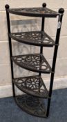 LE CREUSET, A CAST IRON FIVE TIER CORNER PAN STAND Dimensions:width 41cm x depth 28cm x height