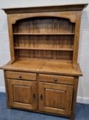 A MODERN OAK DRESSER, the two-tier plate rack atop a base with two drawers, over double cupboard
