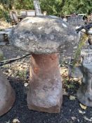 A TALL RED SANDSTONE STADDLE STONE, the top appears to be made from concrete, 50cm diameter,