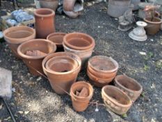 A SELECTION OF TWENTY TERRACOTTA PLANT POTS, of various ages, shapes and sizes, and a chimney pot
