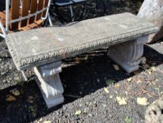 A WEATHERED CONCRETE RECTANGULAR GARDEN BENCH, on a pair of scrolled bases, length 150cm Qty: 3