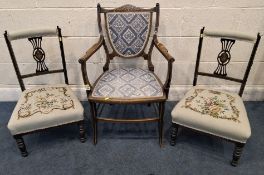AN EDWARDIAN MAHOGANY ARMCHAIR, with scrolled open armrests, along with a pair of low chairs