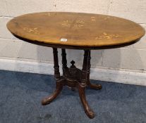AN EDWARDIAN WALNUT OVAL CENTRE TABLE, raised on turned supports Dimensions:width 92cm x depth