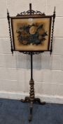 A VICTORIAN MAHOGANY POLE SCREE, the height adjustable screen with a floral insert, scrolled