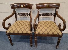 A PAIR OF REGENCY MAHOGANY CARVER CHAIRS, with a curved backrest, scrolled open armrests, raised