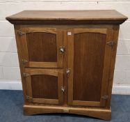 WHITE CLAD, SIMMONS HARDWARE CO., ST LOUIS. USA, A 20TH CENTURY OAK CABINET, fitted with three