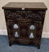 AN EBONISED CHINESE CABINET, with chinoiserie details all over, depicting dragons, flowers and