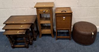 AN EARLY 20TH CENTURY OAK SEWING BOX, the hinged lid enclosing a pincushion and a removable tray,