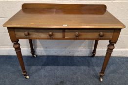 A 19TH CENTURY MAHOGANY LEDGE-BACK SIDE TABLE, with two frieze drawers, raised on cylindrical