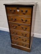 A REPRODUCTION MAHOGANY THREE-DRAWER FILING CABINET, with a green leather writing surface