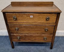 AN EARLY 20TH CENTURY OAK LEDGE-BACK CHEST OF THREE LONG DRAWERS Dimensions:width 77cm x depth
