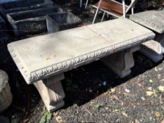 A WEATHERED CONCRETE RECTANGULAR GARDEN BENCH, on a pair of scrolled bases, length 150cm Qty: 3