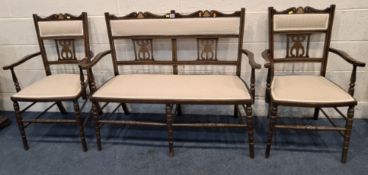 AN EDWARDIAN MAHOGANY PARTIAL PARLOUR SUITE, comprising a two-seater sofa, with bell and strung