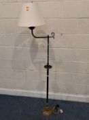 A BRASS TELESCOPIC STANDARD LAMP, with a small dish under the lock for the height mechanism,