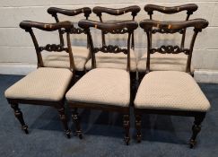 A SET OF SIX VICTORIAN ROSEWOOD CHAIRS, with a scrolled bar back, raised on turned front legs