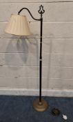 A LAURA ASHLEY BRASS STANDARD LAMP, with an adjustable light fitting Dimensions:height 148cm