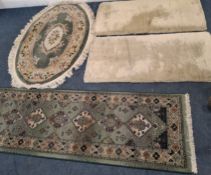 A GREEN GROUND CARPET RUNNER, along with three rugs Dimensions:runner 233cm x 71cm Qty: 4